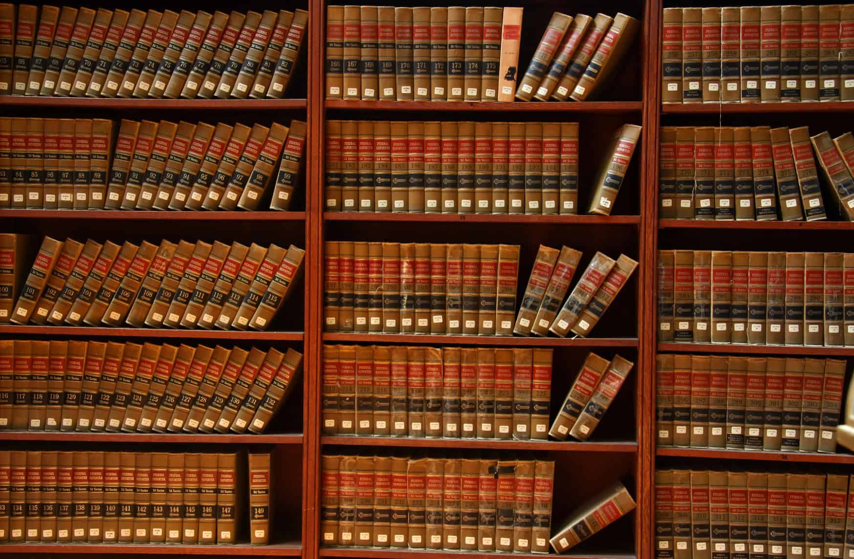 Law books on the shelves of a veterans disability benefits attorney